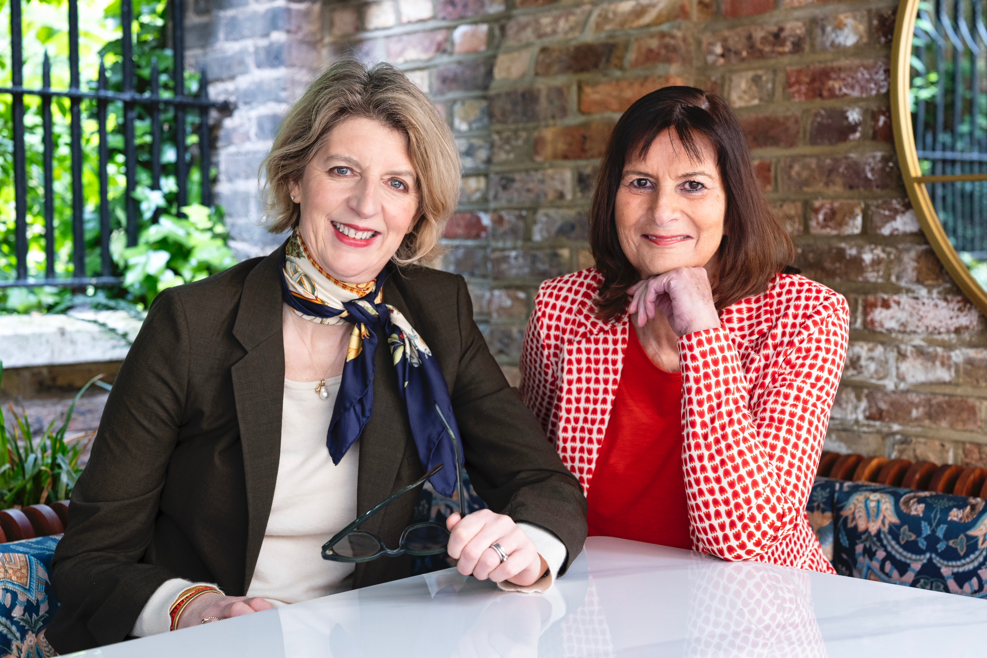 Louise Ballard and Victoria Tomlinson seated at a table